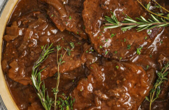 pan full of Cube Steaks with Balsamic Onion Gravy