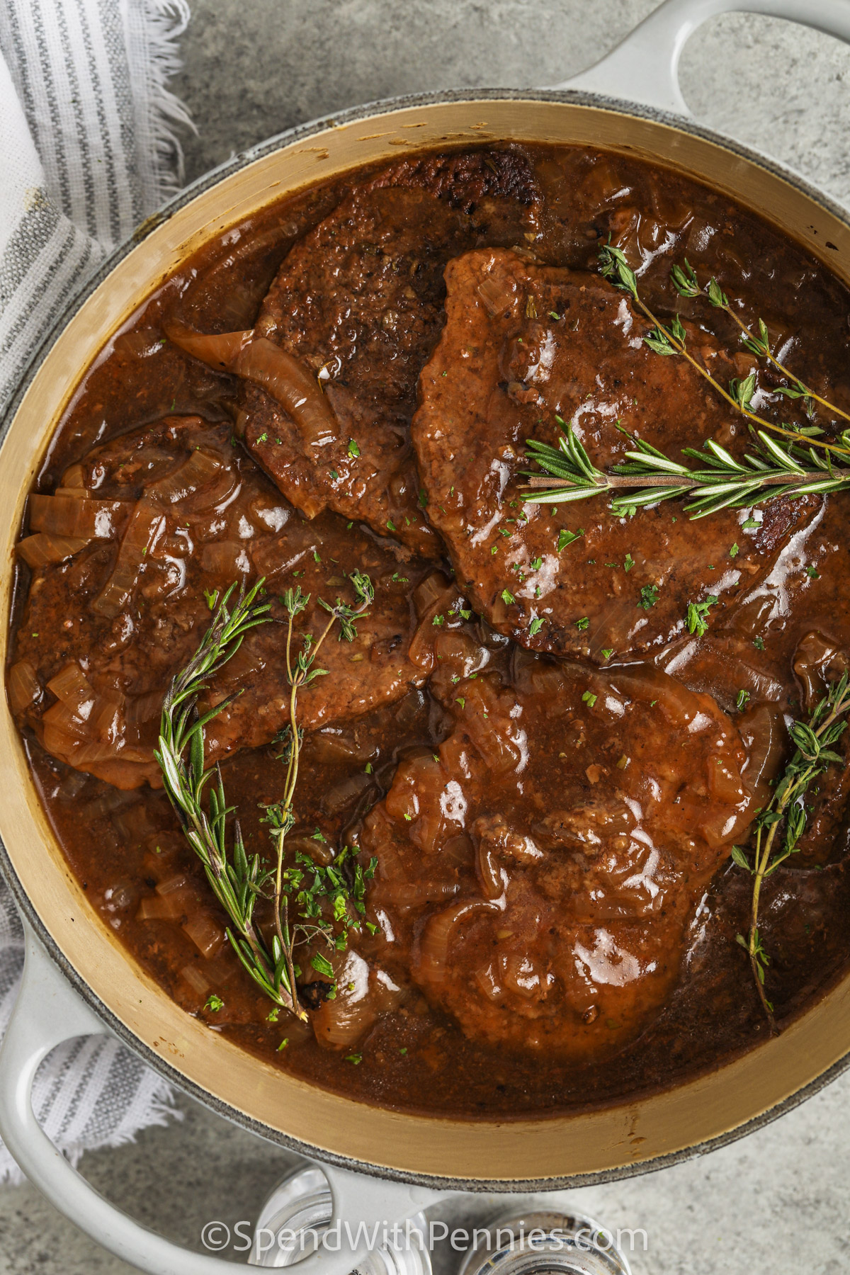 pan full of Cube Steaks with Balsamic Onion Gravy