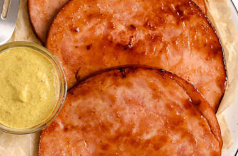 plated Coconut Cake with cake in the back