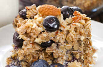 blueberry baked oatmeal on a plate with almonds