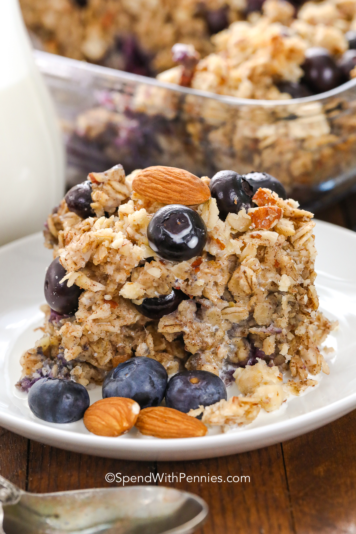 blueberry baked oatmeal on a plate with almonds