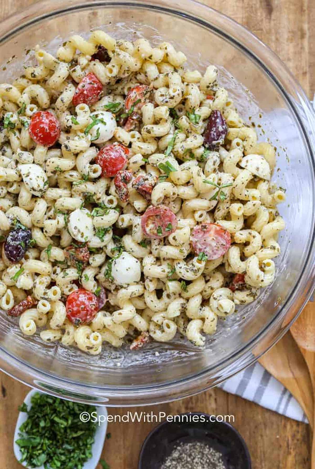 pesto pasta salad in a bowl with parsley