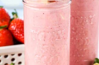 Strawberry Banana Smoothies in jars with fruit