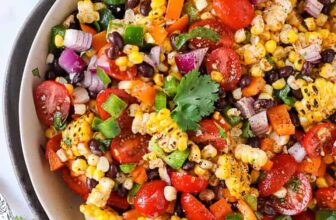 bowl of Black Bean and Corn Salad with limes
