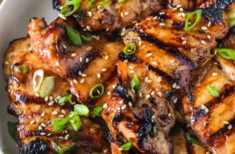 Grilled Teriyaki Chicken plated with sesame seeds