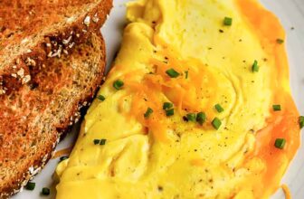 zucchini fritter patties on a plate with ranch