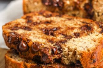 slices of chocolate chip banana bread on a wood board