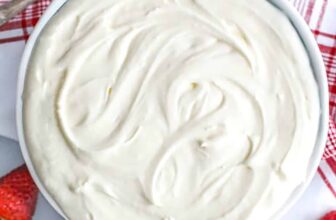 a plate of grilled zucchini with lemon slices