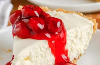 A panzanella salad on a wood board with herbs