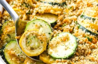 a spoon serving squash casserole