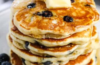 plated Blueberry Pancakes with butter and syrup