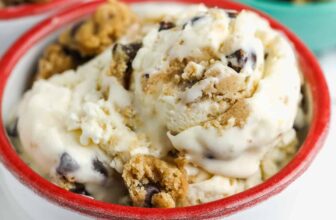 a bowl of homemade cookie dough ice cream with cookie dough in the background