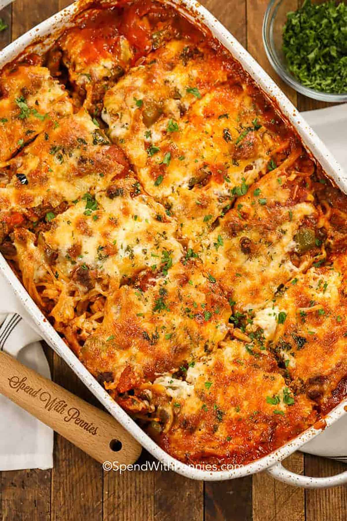 baked spaghetti sliced in a casserole dish