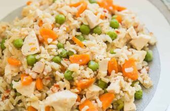 beef stroganoff with egg noodles in a white dutch oven