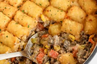 taking a spoonful of Classic Tater Tot-Casserole