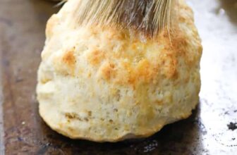 brushing butter on Homemade Biscuits