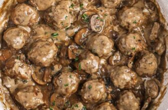 Meatballs in mushroom sauce in a frying pan