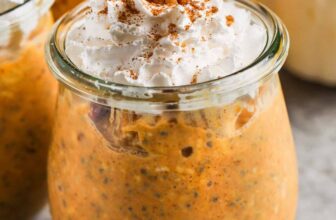 close up of Pumpkin Overnight Oats with pecans and whipped cream