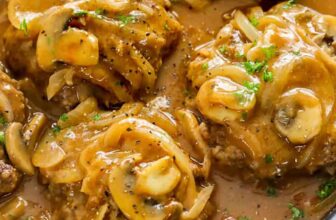 Salisbury Steak topped with mushrooms and sauce