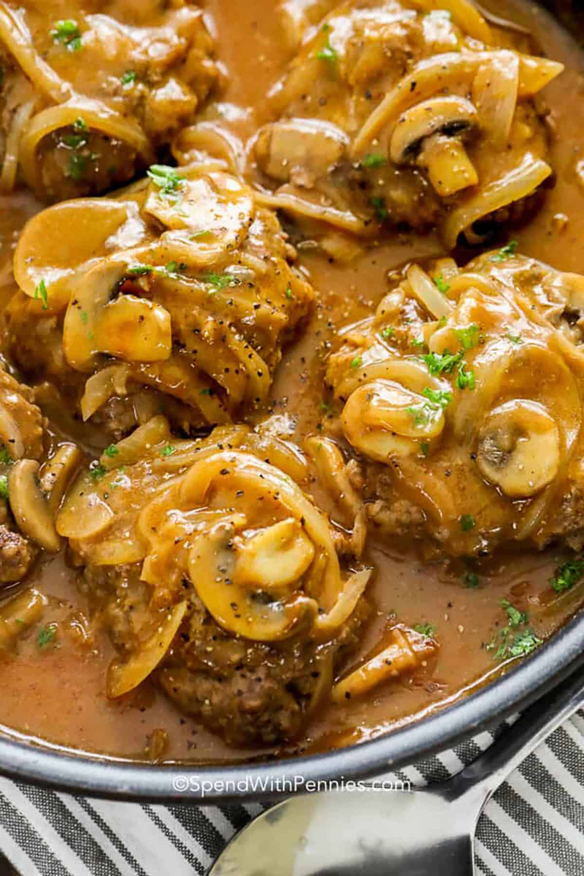 Salisbury Steak topped with mushrooms and sauce