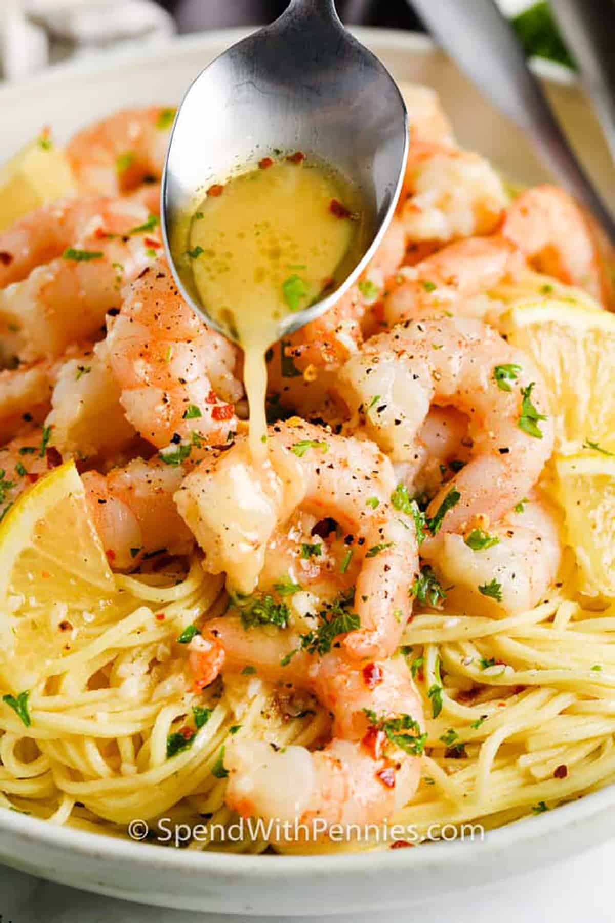 adding sauce to Easy Shrimp Scampi Recipe