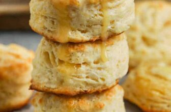 Buttermilk Biscuits in a pile with butter and honey