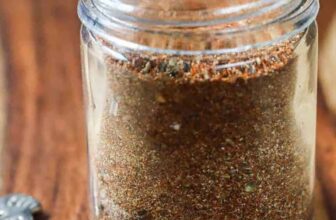 jar of Homemade Taco Seasoning Mix with a spoon full