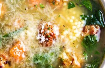 a bowl of French onion soup with a spoon