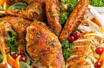 Spatchcock turkey cut into pieces on a platter