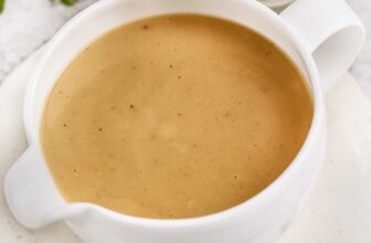 Turkey neck gravy in a white gravy boat