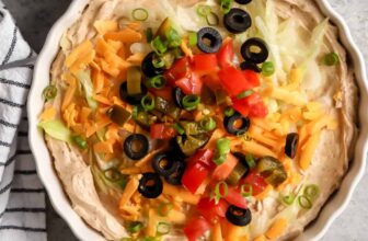 plated Easy Taco Dip with a bowl of chips beside it