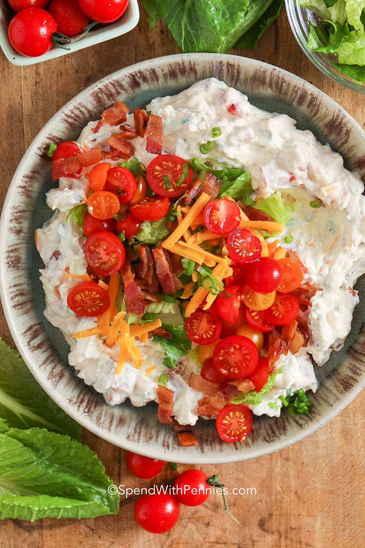 a bowl of shrimp bisque with shrimp and chives on top