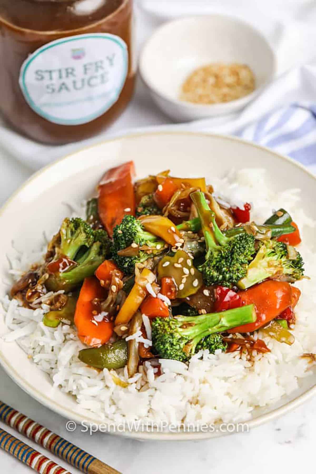 Stir fry sauce served over veggie and rice