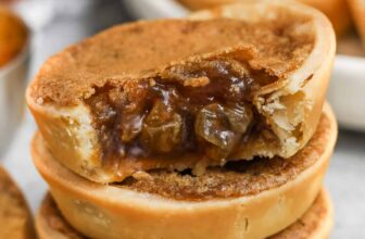 Butter Tarts in a pile and a bite taken out of one