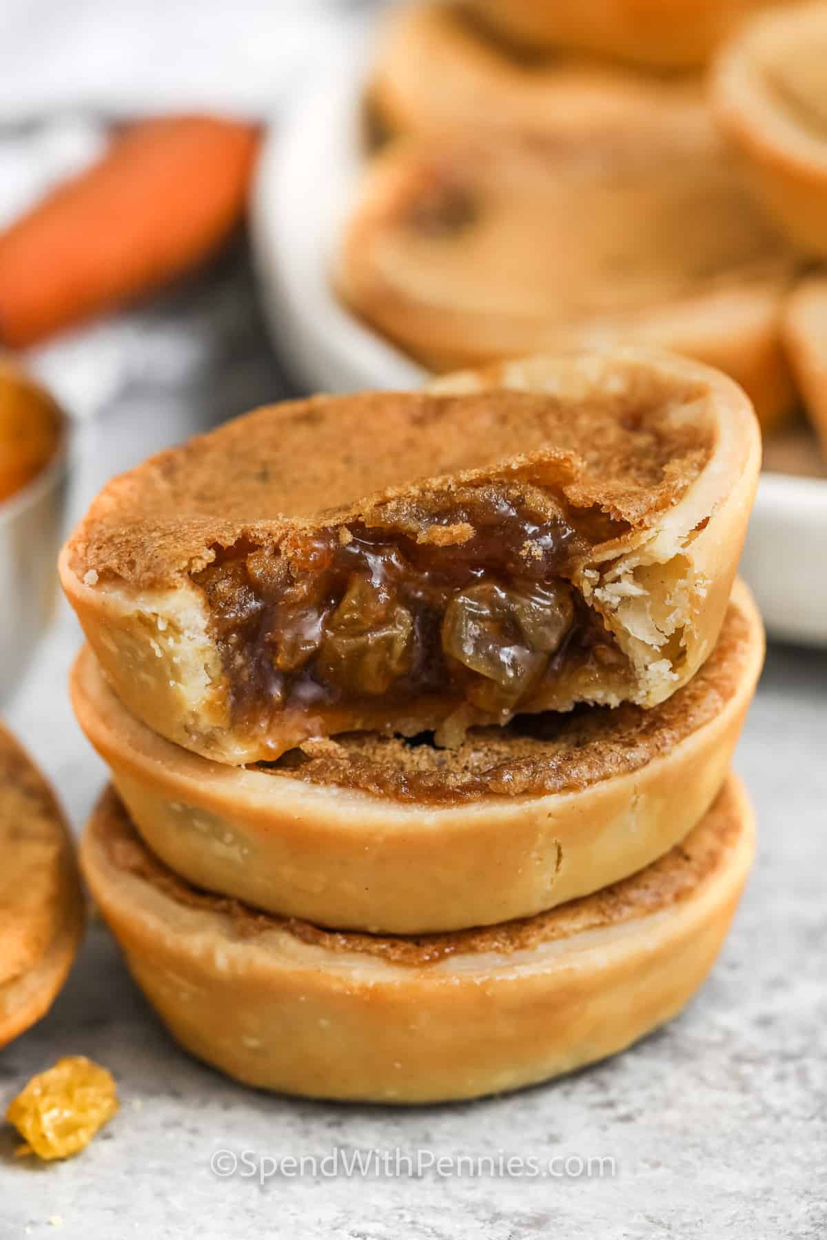 Butter Tarts in a pile and a bite taken out of one