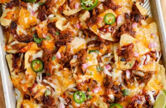 cheesy Pulled Pork Nachos on a sheet pan