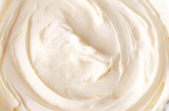 Watergate Salad with whipped cream and a cherry on top