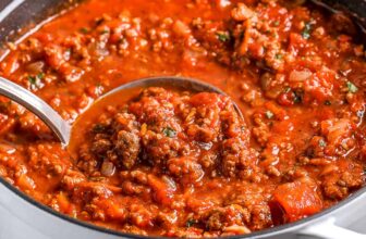 ladle scooping homemade spaghetti sauce with text