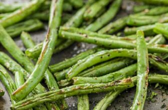 Roasted green beans on a baking sheet