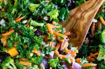 Easy Kale Salad in a bowl with a serving spoon