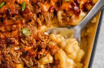 taking a spoonful of Pulled Pork Mac and Cheese