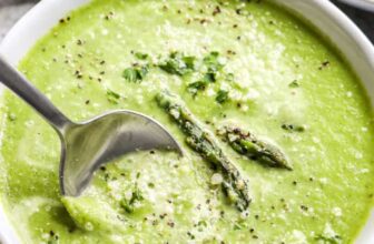 Asparagus Soup in a white bowl with a spoon