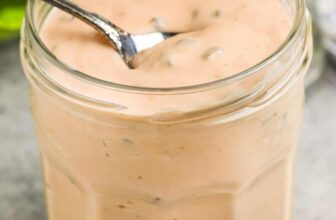 Thousand Island Dressing being scooped out of a jar